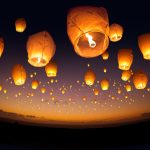 A large group of chinese flying lanterns.